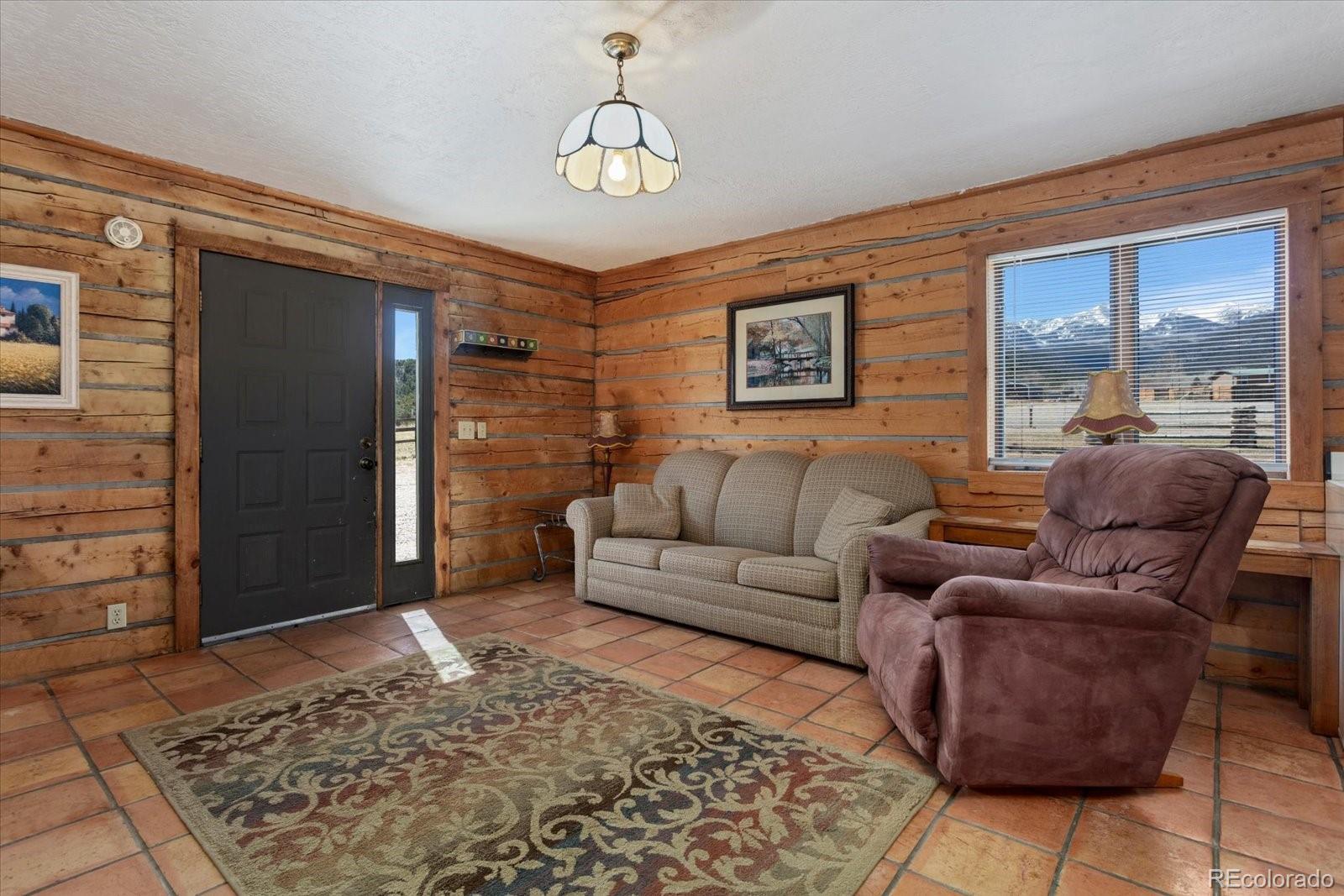 716 West Blarney Stone Road Howard, CO 81233 - Photo 33 of 50 a living room with furniture and a rug