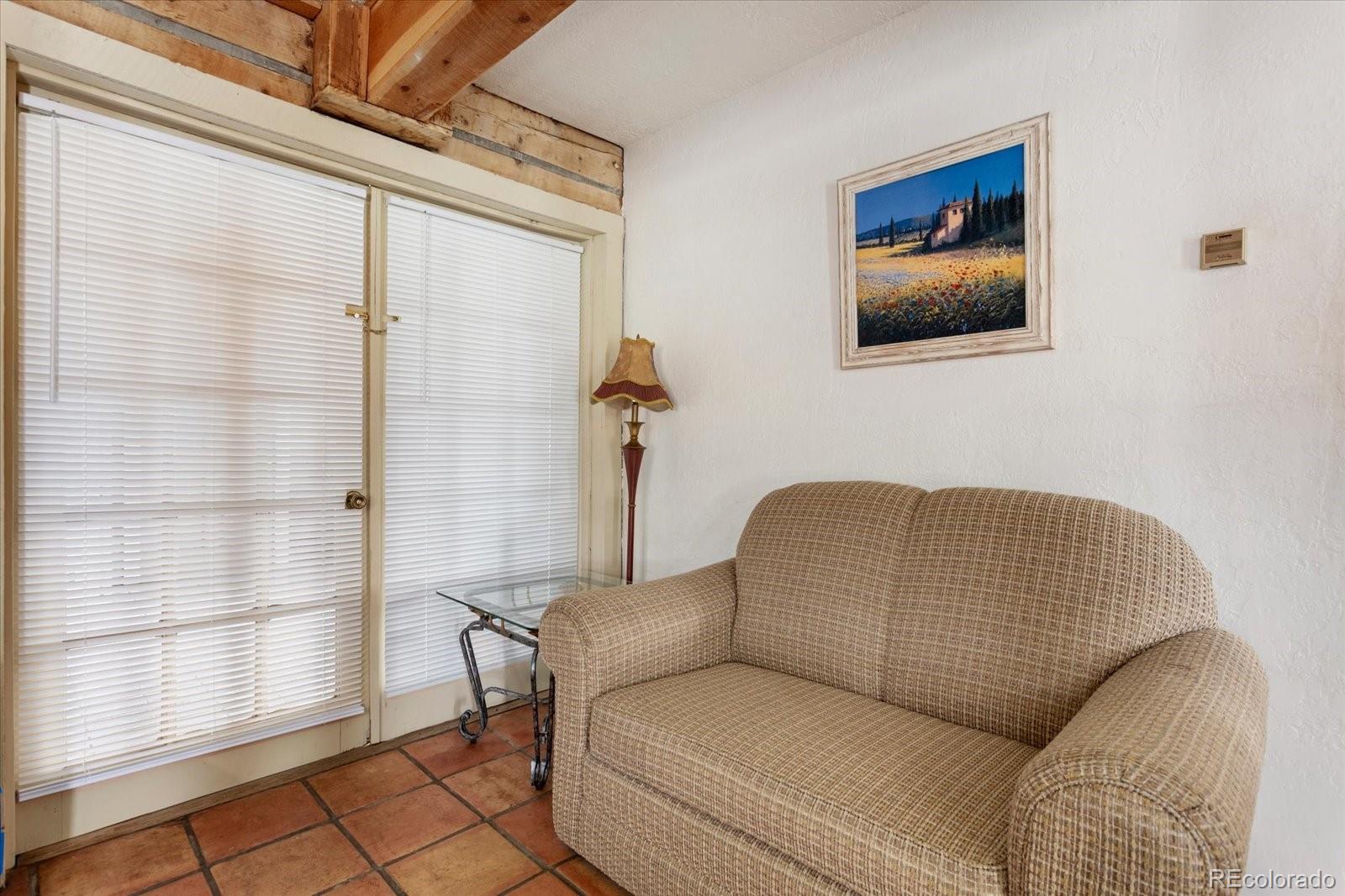 716 West Blarney Stone Road Howard, CO 81233 - Photo 36 of 50 a living room with furniture and a window