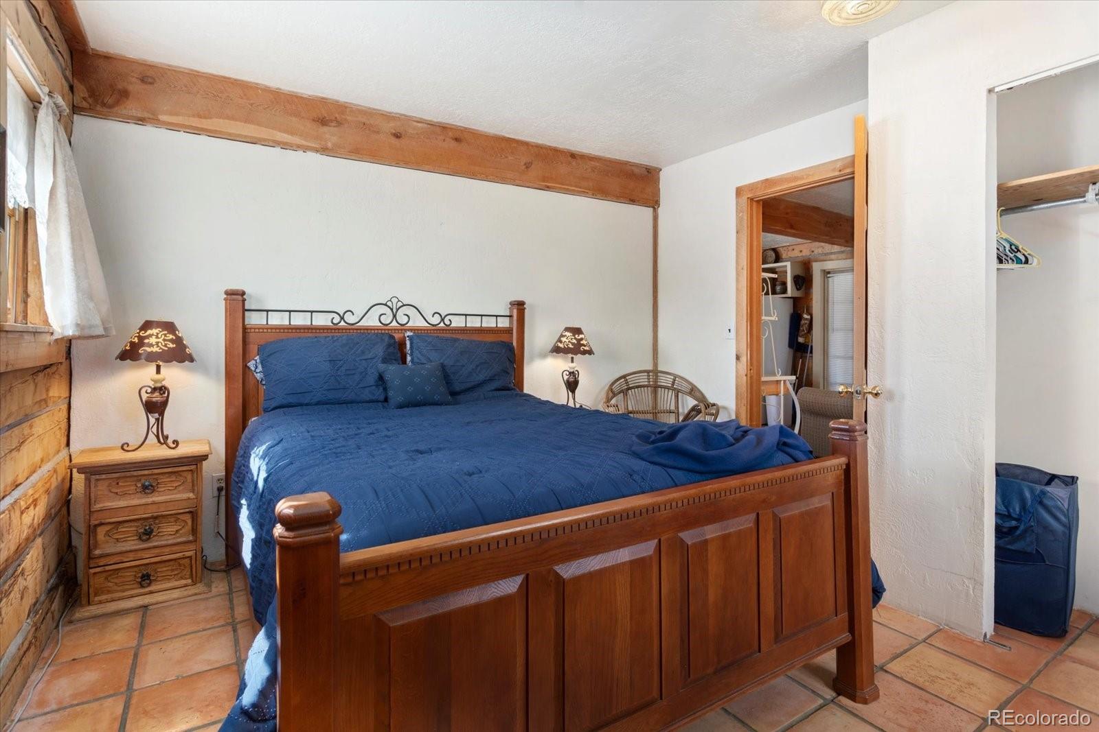 716 West Blarney Stone Road Howard, CO 81233 - Photo 41 of 50 a bedroom with a bed and furniture