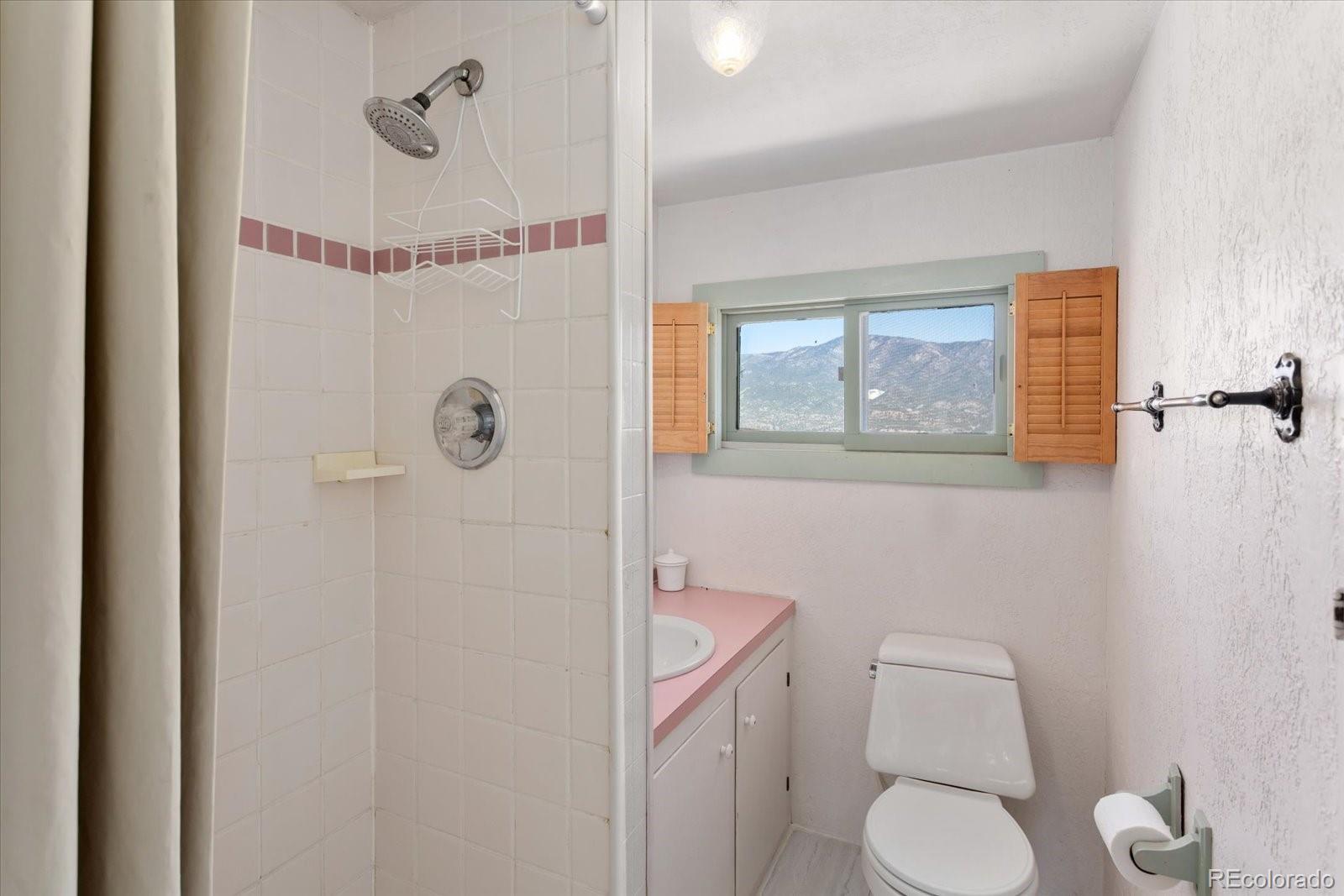 716 West Blarney Stone Road Howard, CO 81233 - Photo 49 of 50 a white toilet sitting next to a bathroom sink