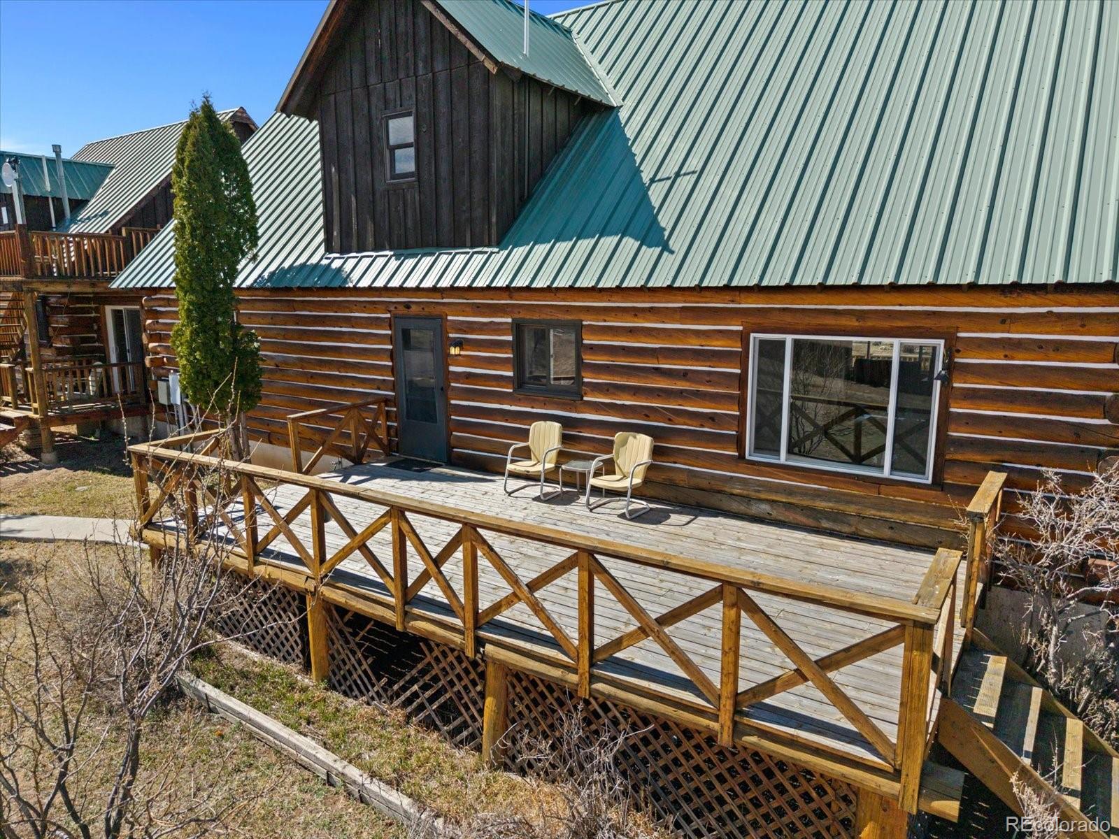 716 West Blarney Stone Road Howard, CO 81233 - Photo 50 of 50 a view of a house with backyard and deck