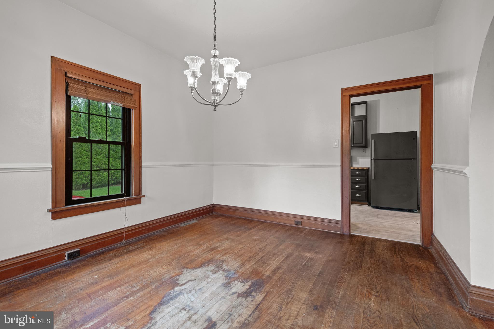 209 Ironstone Ridge Road Lancaster, PA 17603 - Photo 12 of 50 a view of an empty room with wooden floor and a window