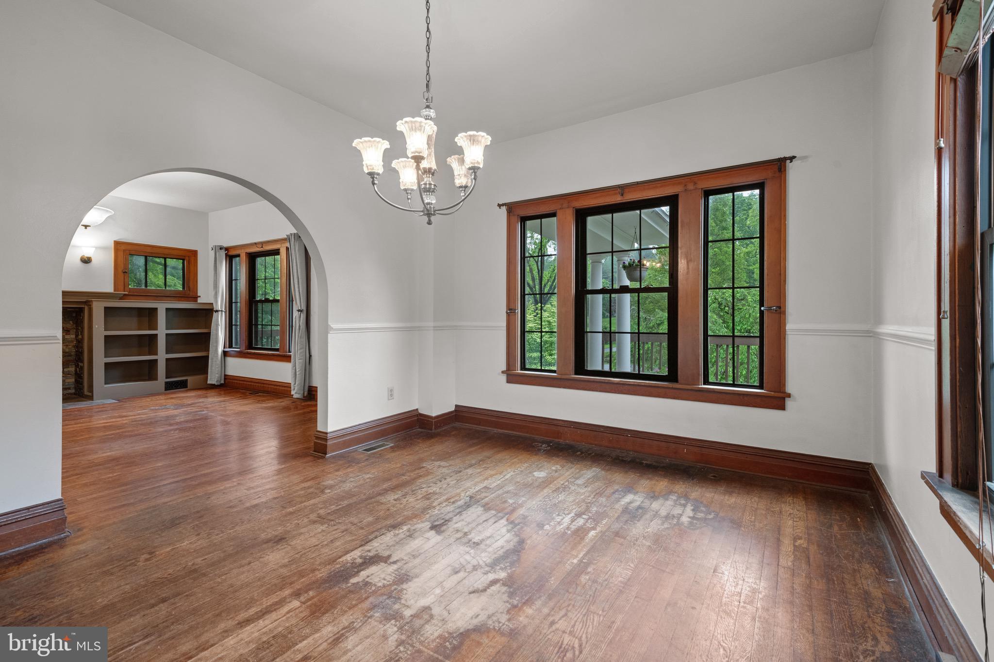 209 Ironstone Ridge Road Lancaster, PA 17603 - Photo 14 of 50 a view of an empty room with wooden floor kitchen view and a window