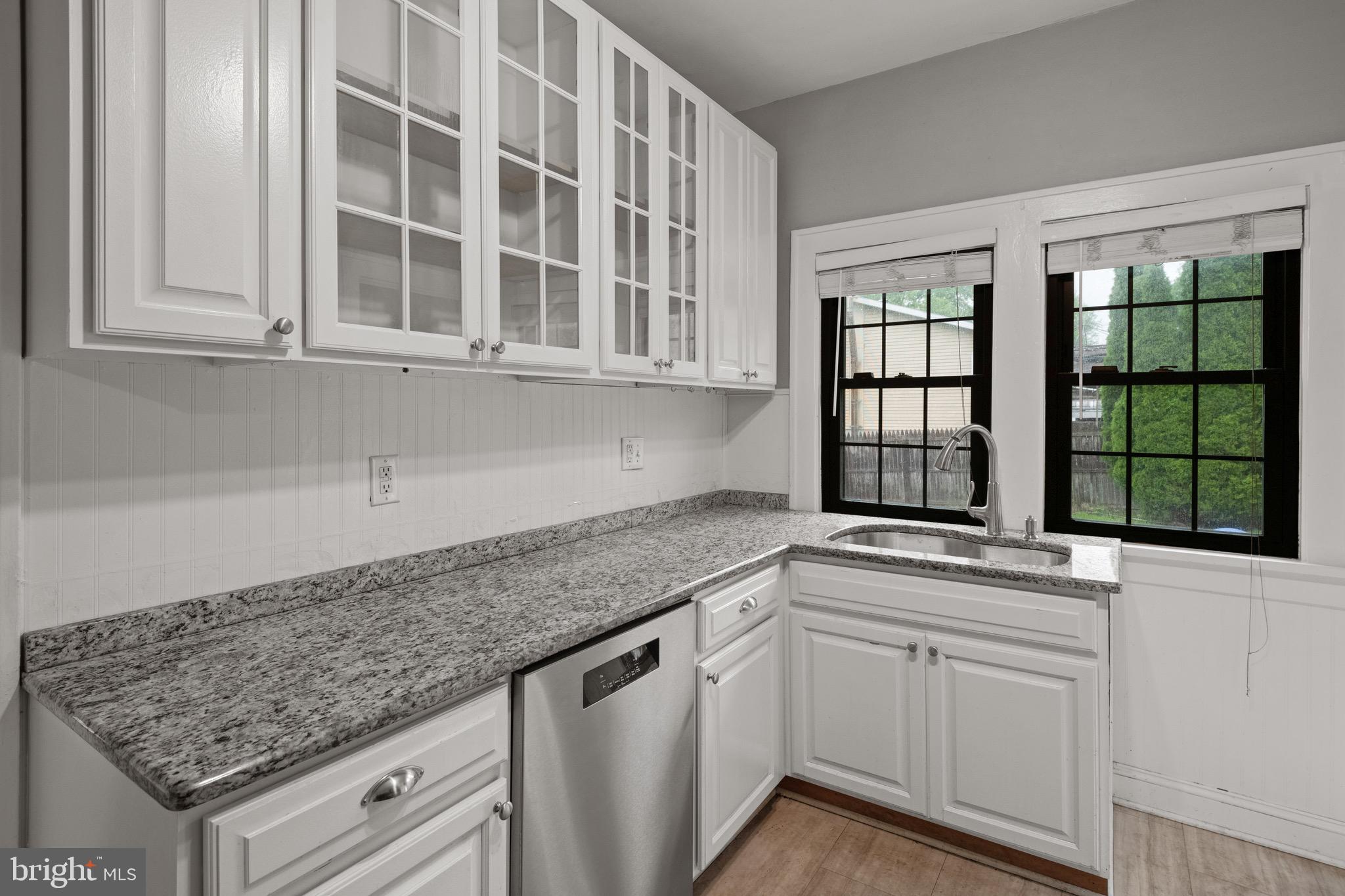 209 Ironstone Ridge Road Lancaster, PA 17603 - Photo 17 of 50 a kitchen with granite countertop a sink and a window