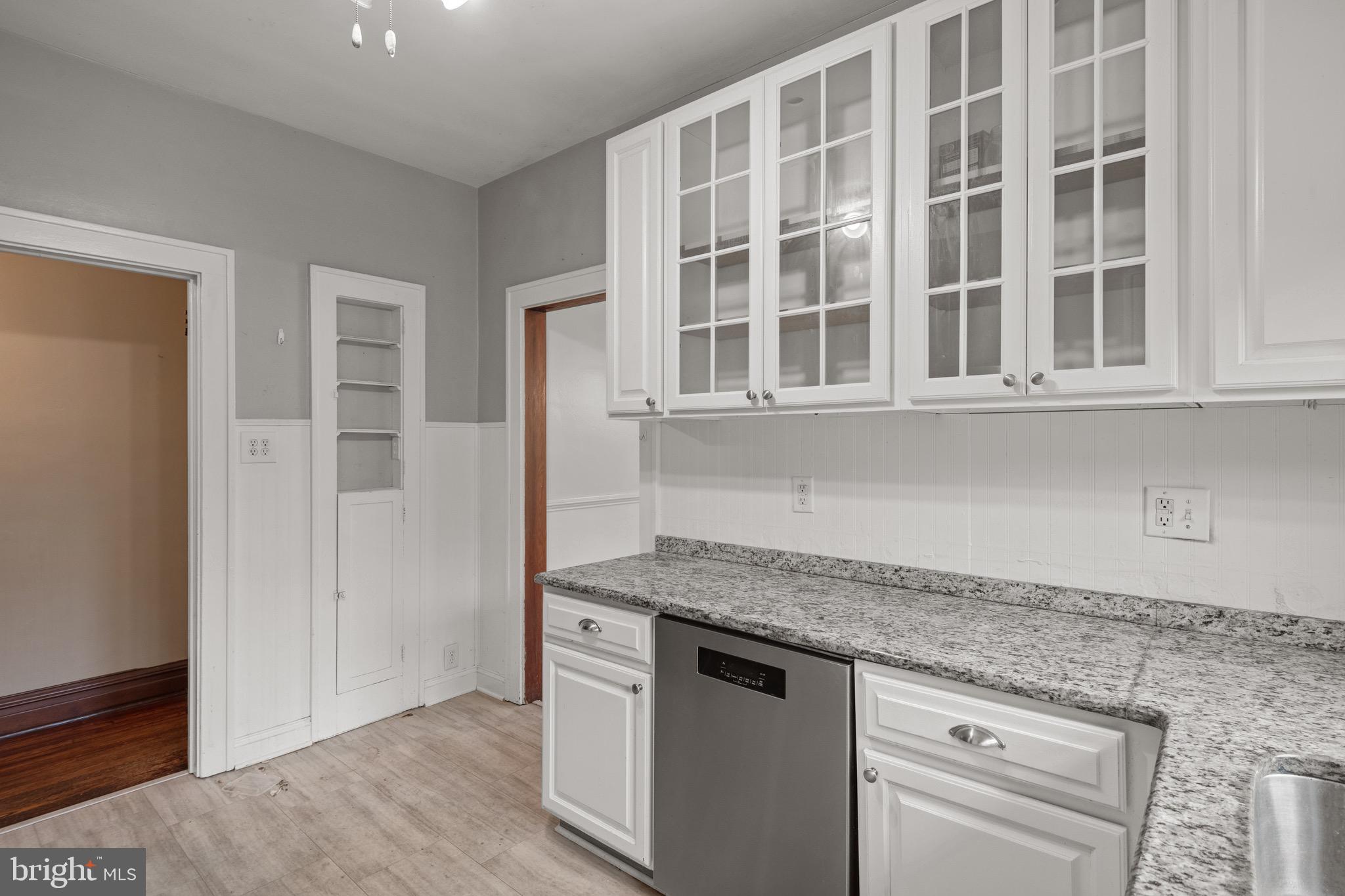 209 Ironstone Ridge Road Lancaster, PA 17603 - Photo 18 of 50 a view of granite countertop cabinets and wooden floor