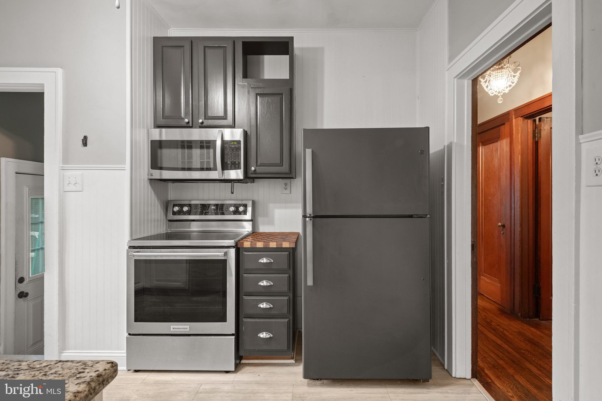 209 Ironstone Ridge Road Lancaster, PA 17603 - Photo 19 of 50 a kitchen with a refrigerator and a stove