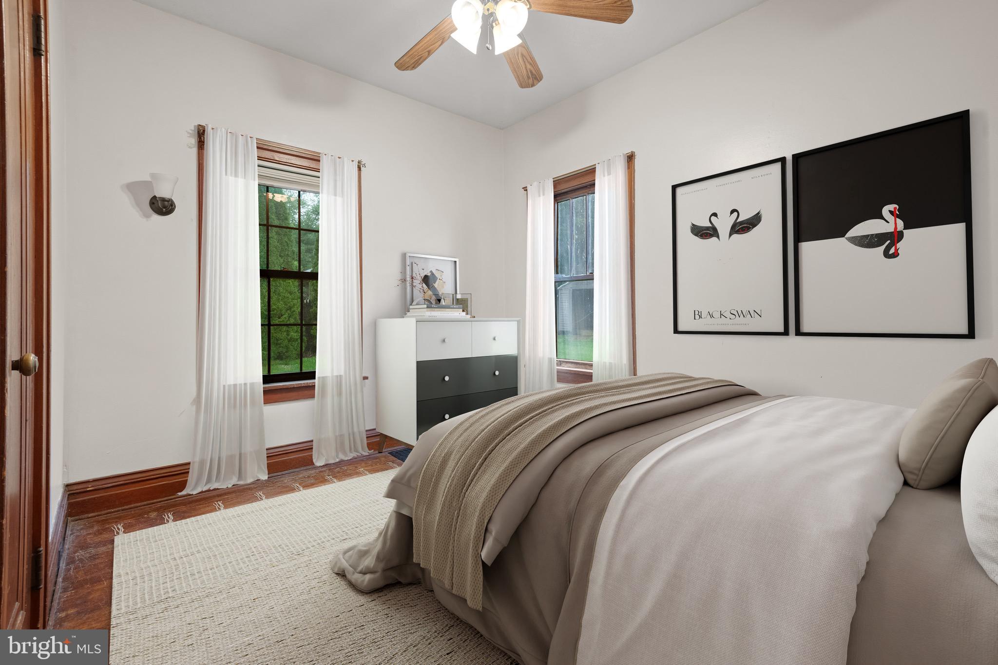 209 Ironstone Ridge Road Lancaster, PA 17603 - Photo 24 of 50 a bedroom with a large bed and a chandelier