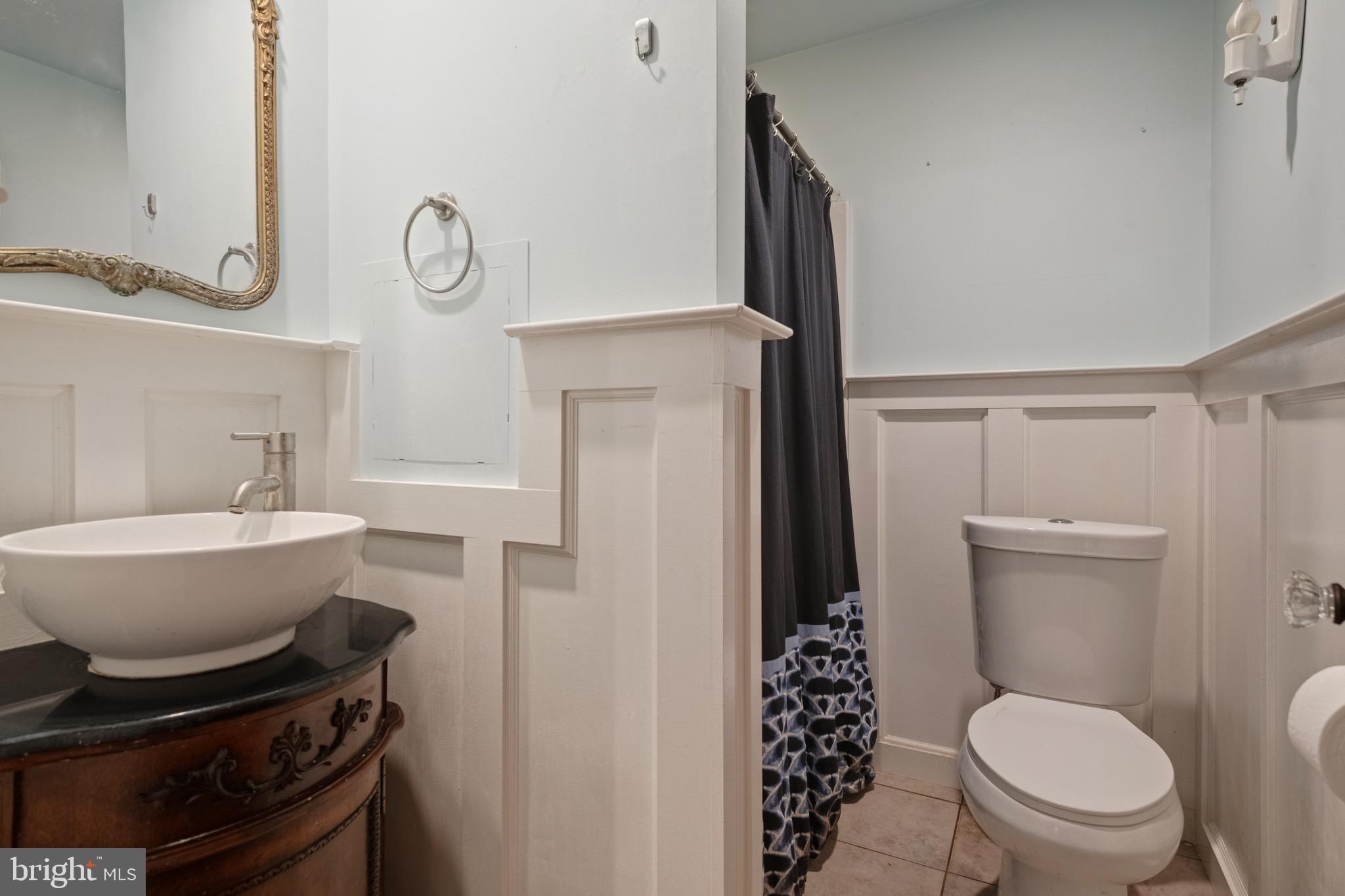 209 Ironstone Ridge Road Lancaster, PA 17603 - Photo 29 of 50 a bathroom with a toilet a sink and a mirror