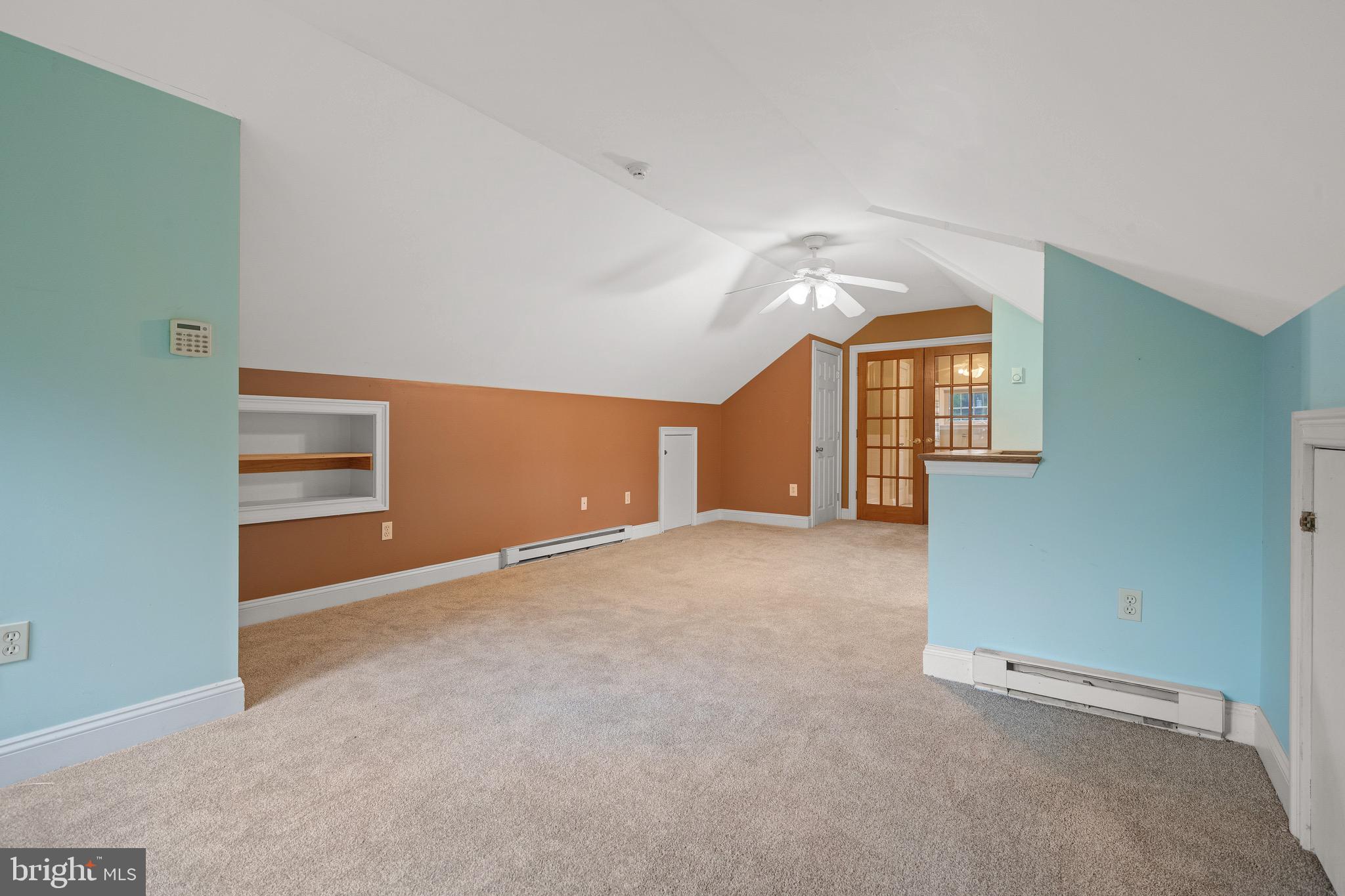 209 Ironstone Ridge Road Lancaster, PA 17603 - Photo 32 of 50 an empty room with a fireplace and windows