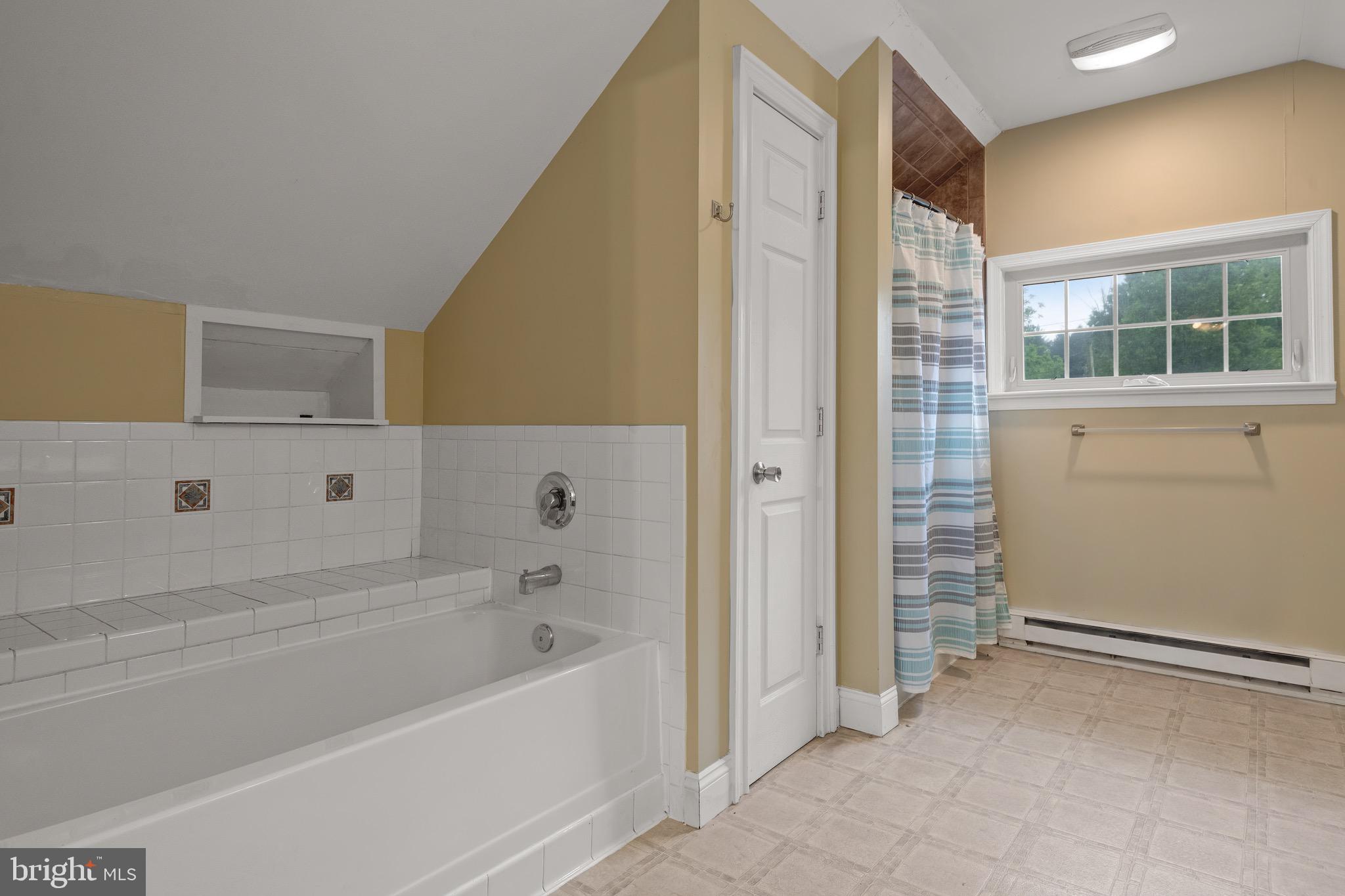 209 Ironstone Ridge Road Lancaster, PA 17603 - Photo 35 of 50 a bathroom with a bathtub and a shower
