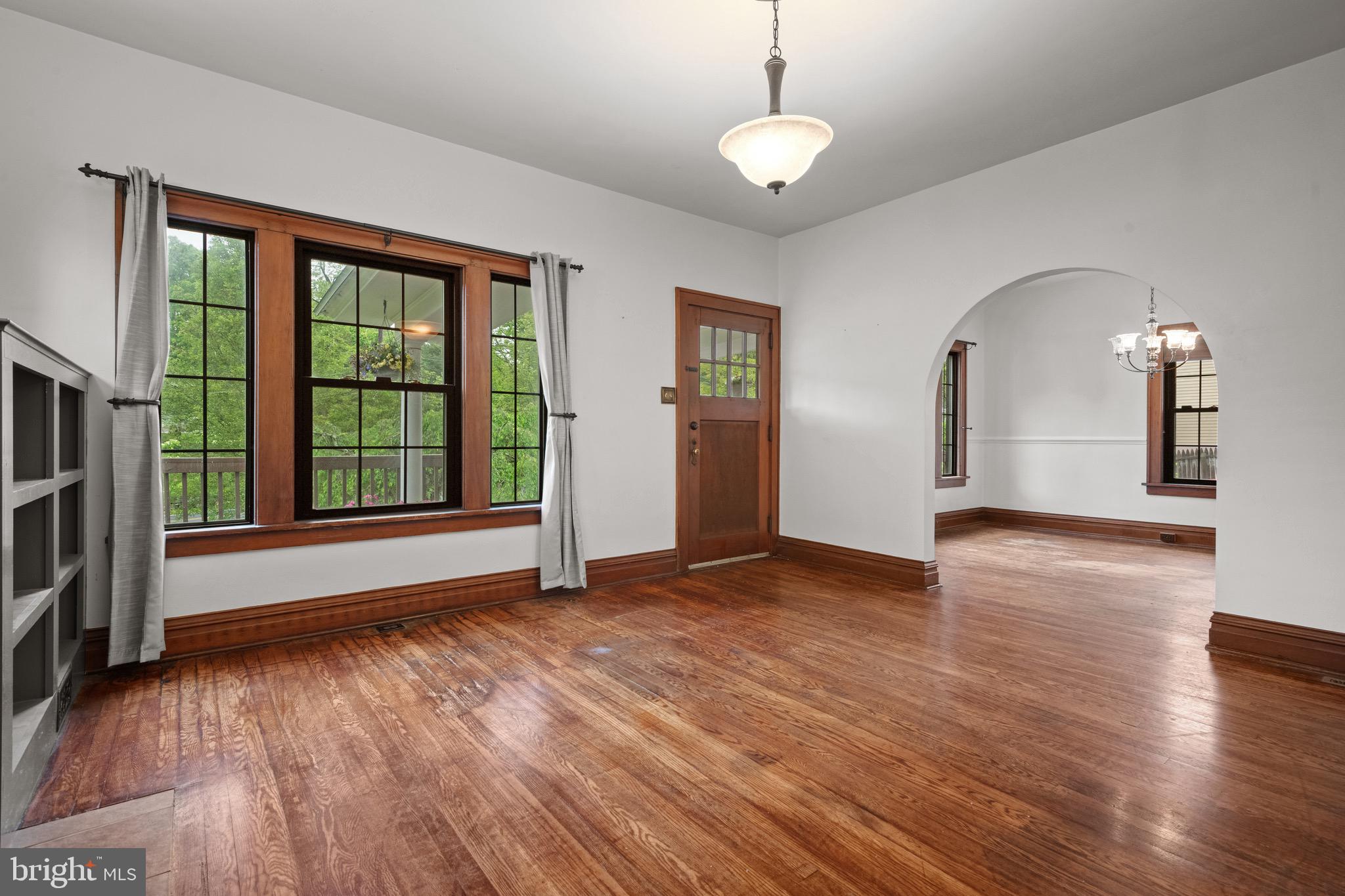 209 Ironstone Ridge Road Lancaster, PA 17603 - Photo 10 of 50 a view of an empty room with wooden floor and a window
