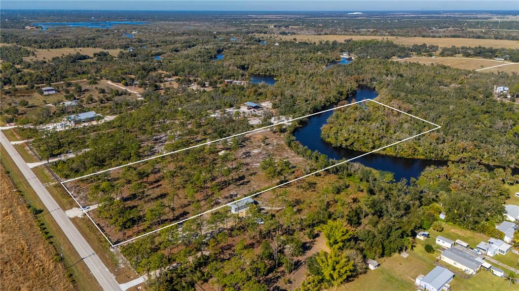 36051 Washington Loop Road Punta Gorda, FL 33982 - Photo 3 of 13 an aerial view of residential houses with outdoor space