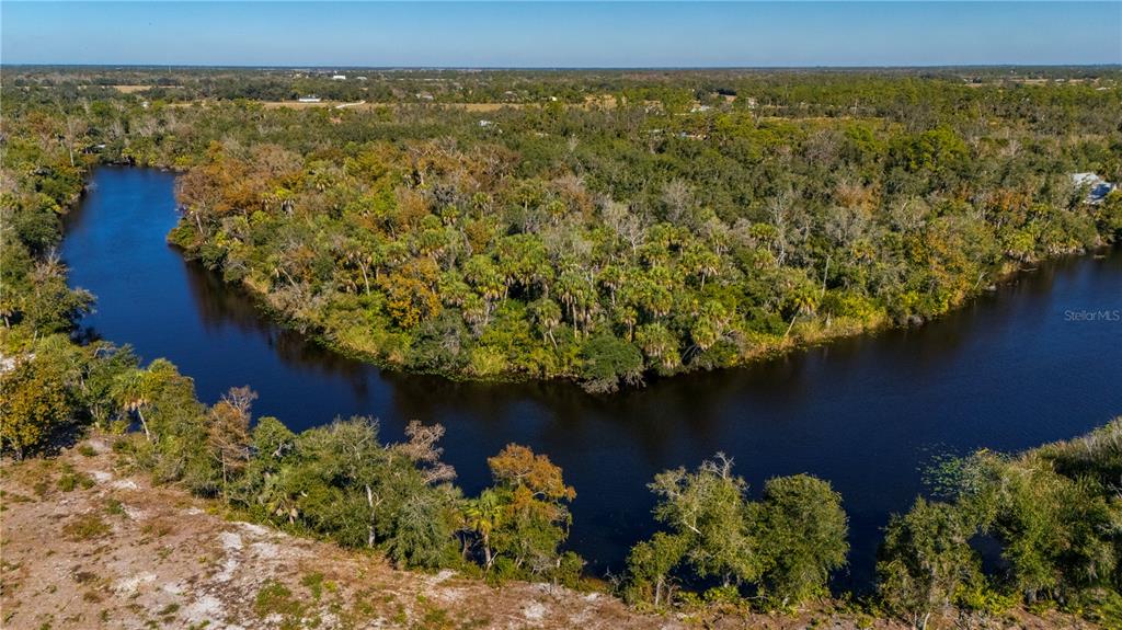 36051 Washington Loop Road Punta Gorda, FL 33982 - Photo 5 of 13 an aerial view of a house with a yard