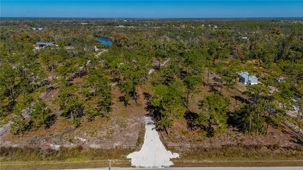 36051 Washington Loop Road Punta Gorda, FL 33982 - Photo 7 of 13 a view of outdoor space and trees
