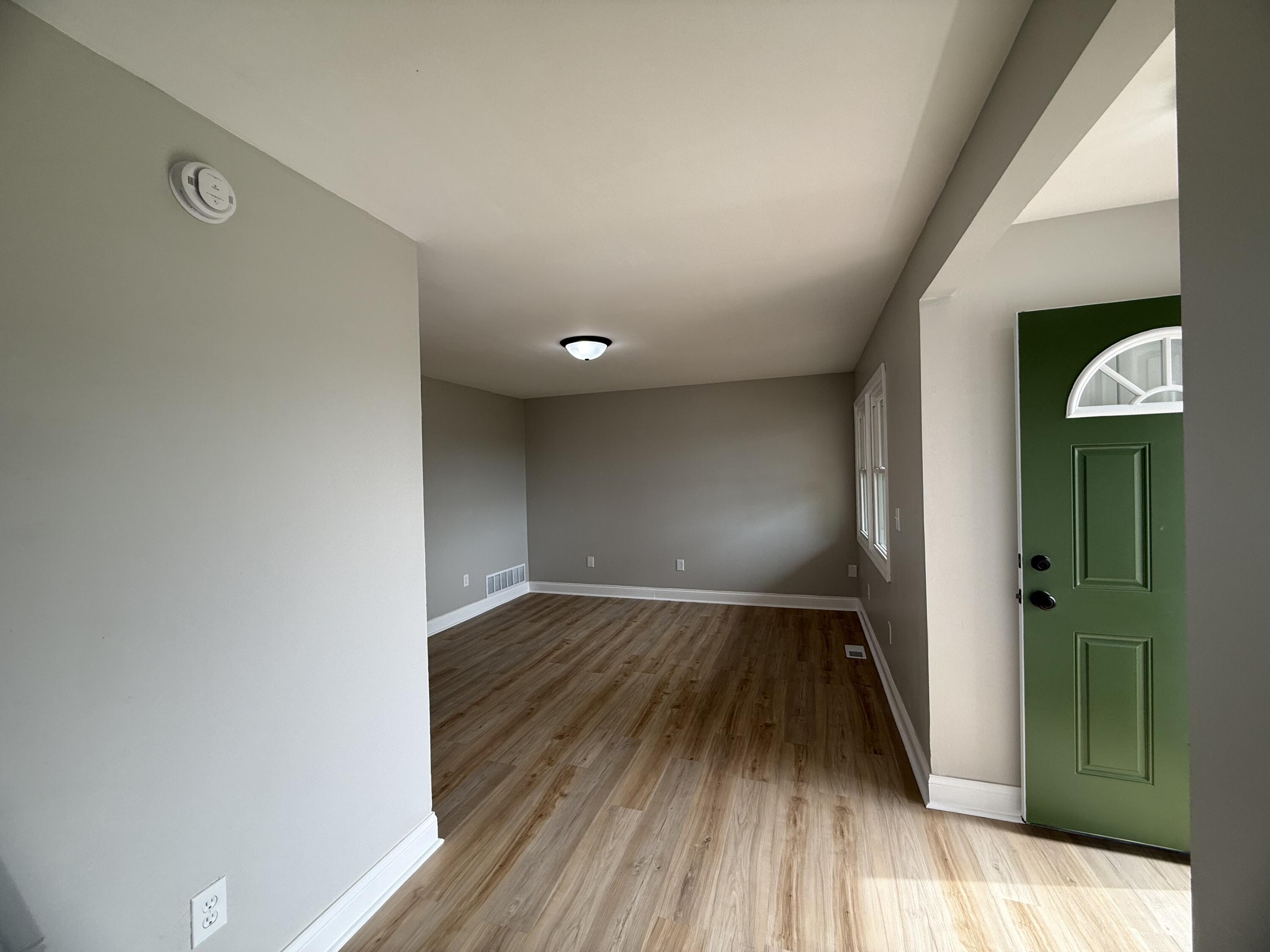 15895 Sherman Street Lowell, IN 46356 - Photo 5 of 36 a view of empty room with wooden floor