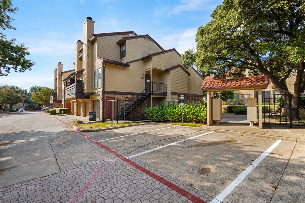 4130 Proton Drive, Unit 6D Addison, TX 75001 - Photo 3 of 38 a front view of a house with a yard