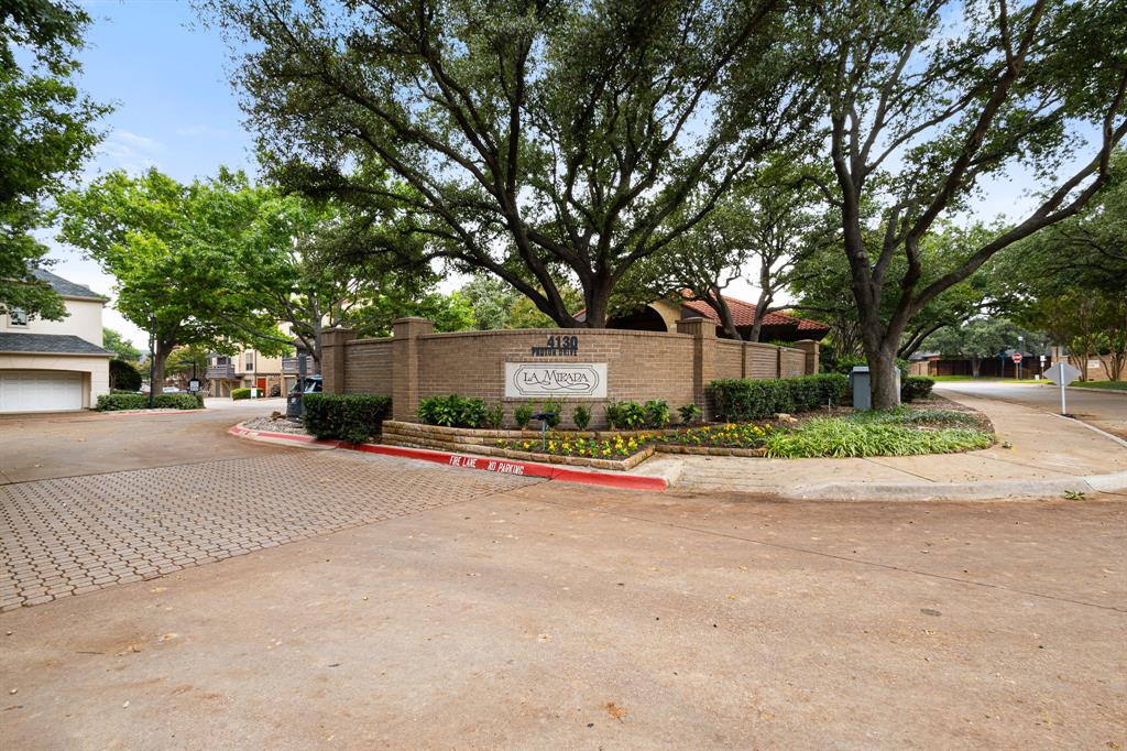 4130 Proton Drive, Unit 6D Addison, TX 75001 - Photo 32 of 38 a view of street with large trees