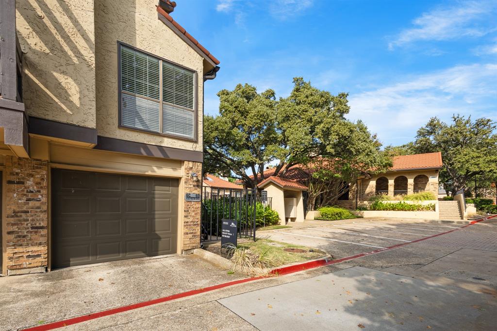 4130 Proton Drive, Unit 6D Addison, TX 75001 - Photo 4 of 38 a building with trees in front of it