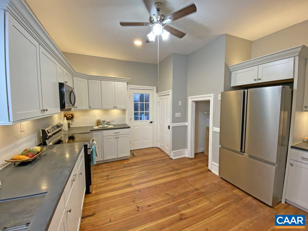 183 Summerdean Road Middlebrook, VA 24459 - Photo 13 of 36 a kitchen with stainless steel appliances a refrigerator sink and microwave