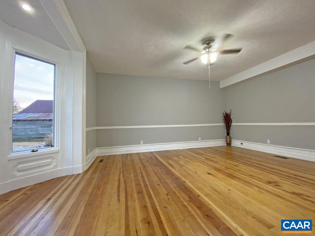 183 Summerdean Road Middlebrook, VA 24459 - Photo 7 of 36 a view of empty room with wooden floor and fan