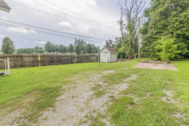 a swimming pool with wooden fence