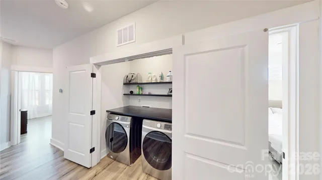 a utility room with dryer and washer
