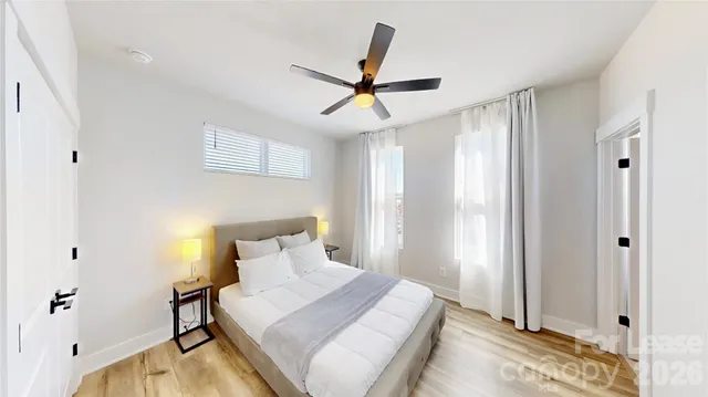 a bedroom with a bed and a window