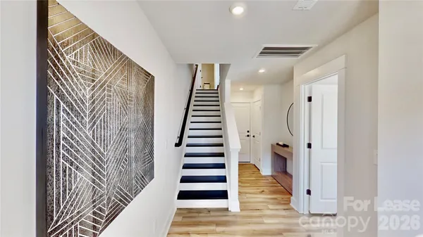 a view of entryway with wooden floor