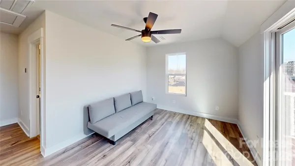 a living room with couch and a window