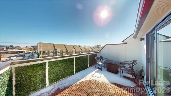 a view of balcony with furniture