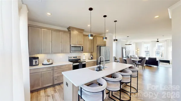 a kitchen with a sink a counter space and appliances