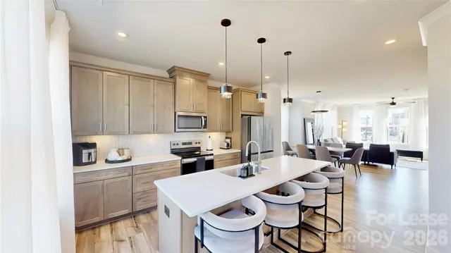 a kitchen with a sink a counter space and appliances