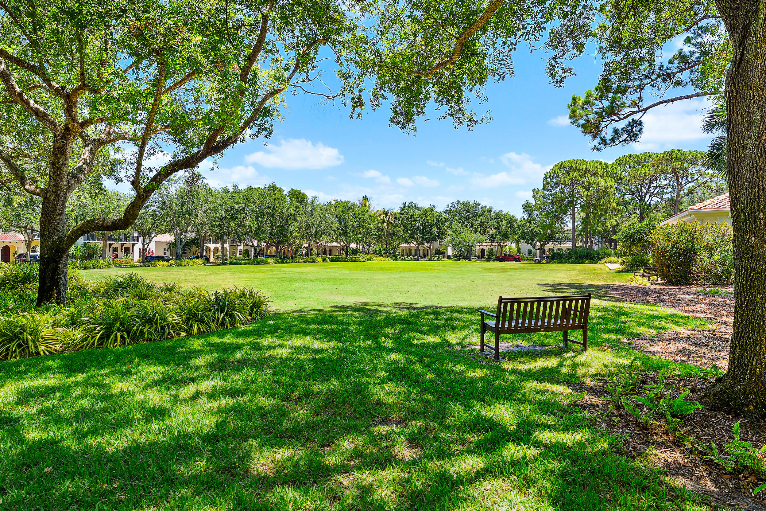 105 Segovia Way Jupiter, FL 33458 - Photo 26 of 33 a bench sitting in the middle of a park