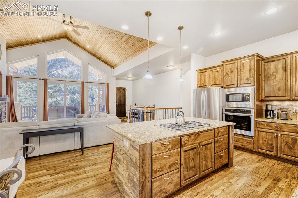 4519 Edwards Place Cascade, CO 80809 - Photo 13 of 47 Cooks delight kitchen featuring open floor plan, with breakfast bar and plenty of workspace and storage