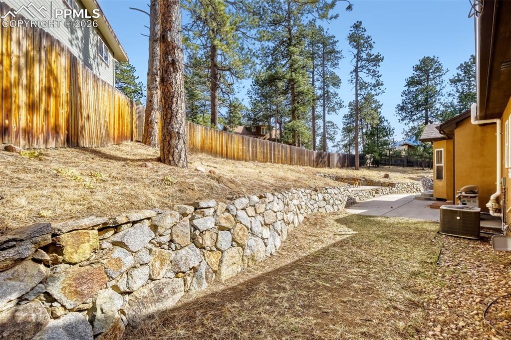 4519 Edwards Place Cascade, CO 80809 - Photo 36 of 47 Fenced backyard with a patio area