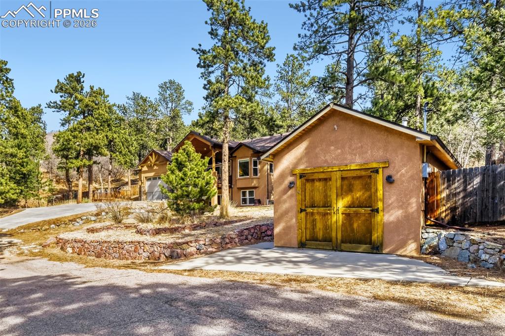 4519 Edwards Place Cascade, CO 80809 - Photo 42 of 47 Workshop includes a wood burning stove and eclectic service