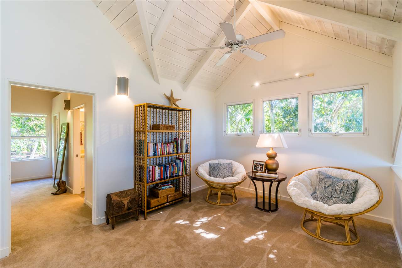 100 Laenani Street Haiku, HI 96708 - Photo 20 of 30 a living room with furniture a window and a book shelf