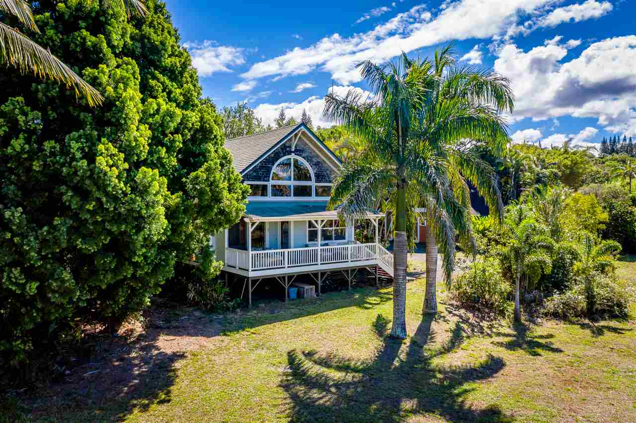 100 Laenani Street Haiku, HI 96708 - Photo 2 of 30 a view of a house with swimming pool next to a yard
