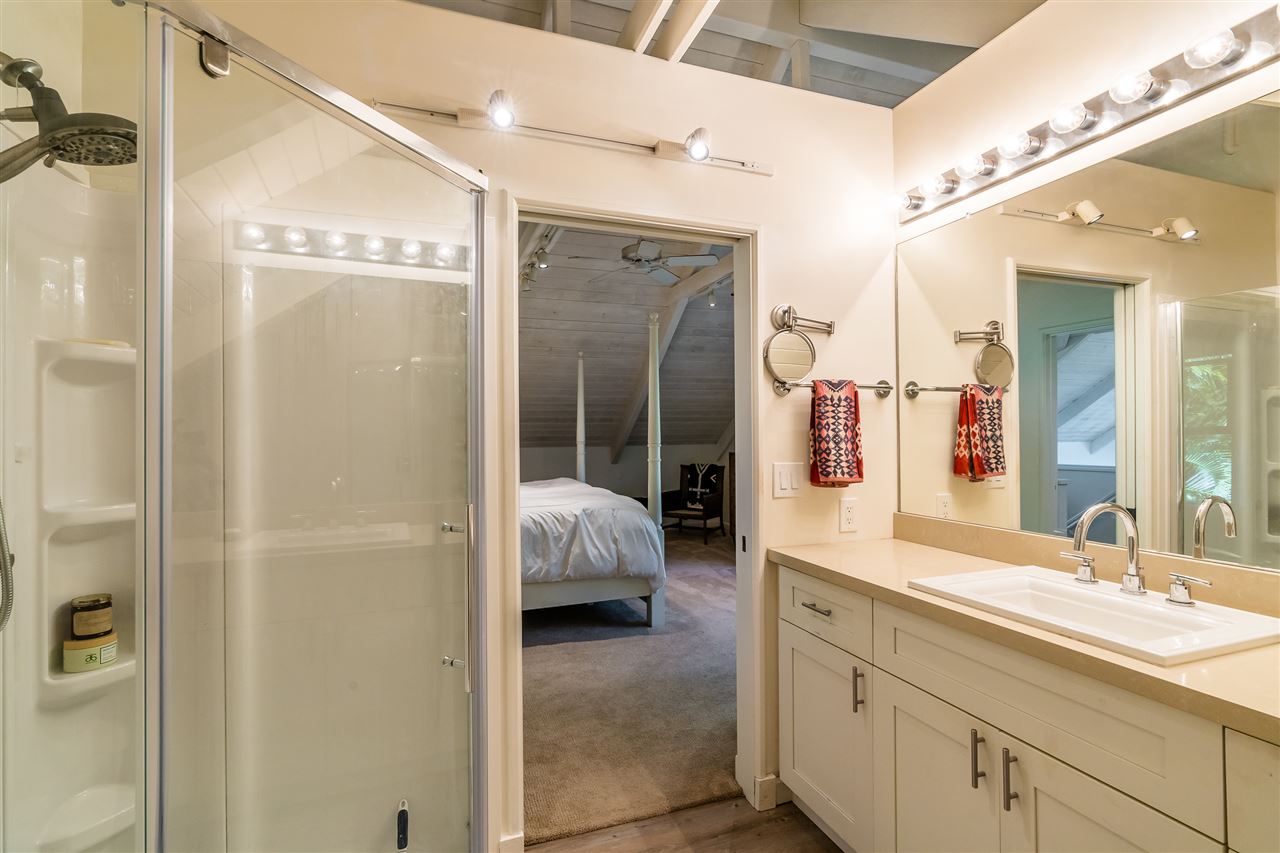 100 Laenani Street Haiku, HI 96708 - Photo 22 of 30 a en suite bathroom with a double vanity sink a mirror and shower