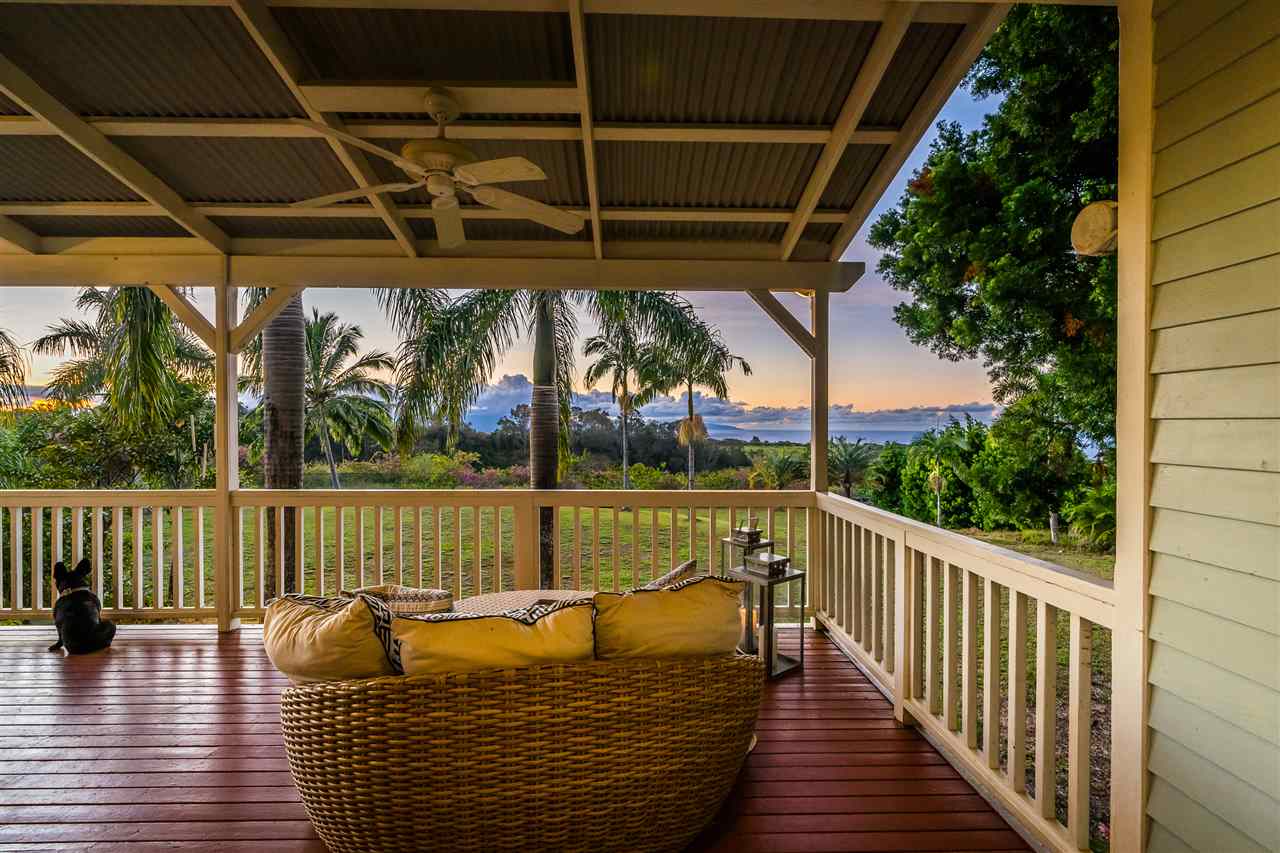 100 Laenani Street Haiku, HI 96708 - Photo 30 of 30 a view of balcony with wooden floor and outdoor seating
