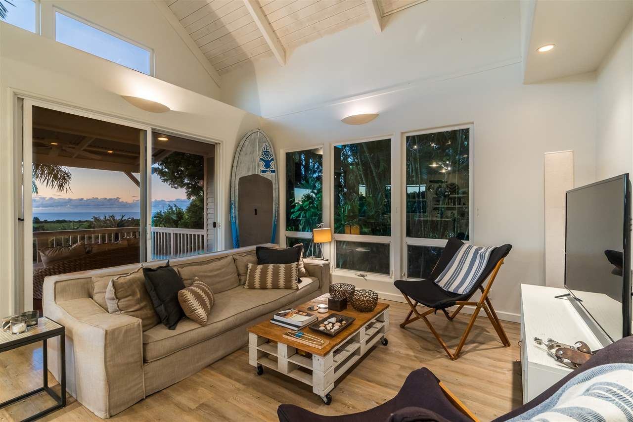 100 Laenani Street Haiku, HI 96708 - Photo 9 of 30 a living room with furniture and a large window