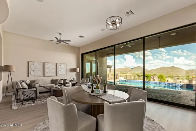 a spacious bathroom with a granite countertop sink and a bathtub
