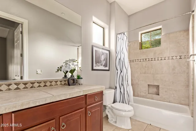 a front view of a house with a yard table and chairs