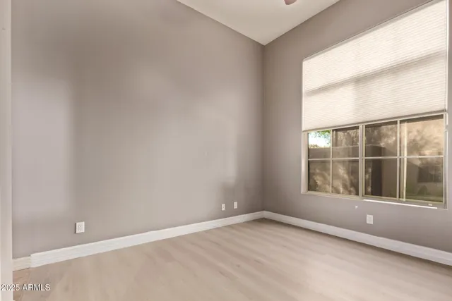 a view of a balcony with two chairs and a table