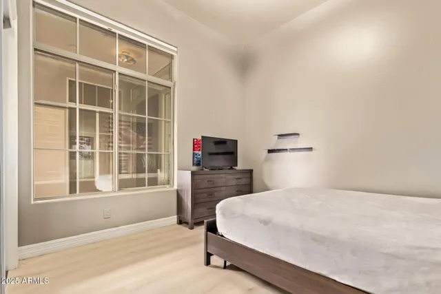 a view of a lake with couches and city view