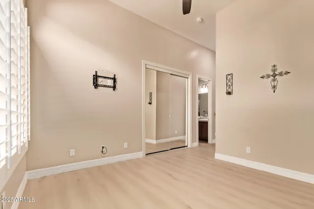 a view of a terrace with lawn chairs