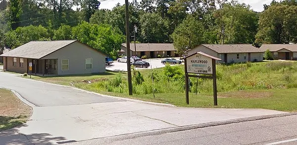 a house with trees in the background