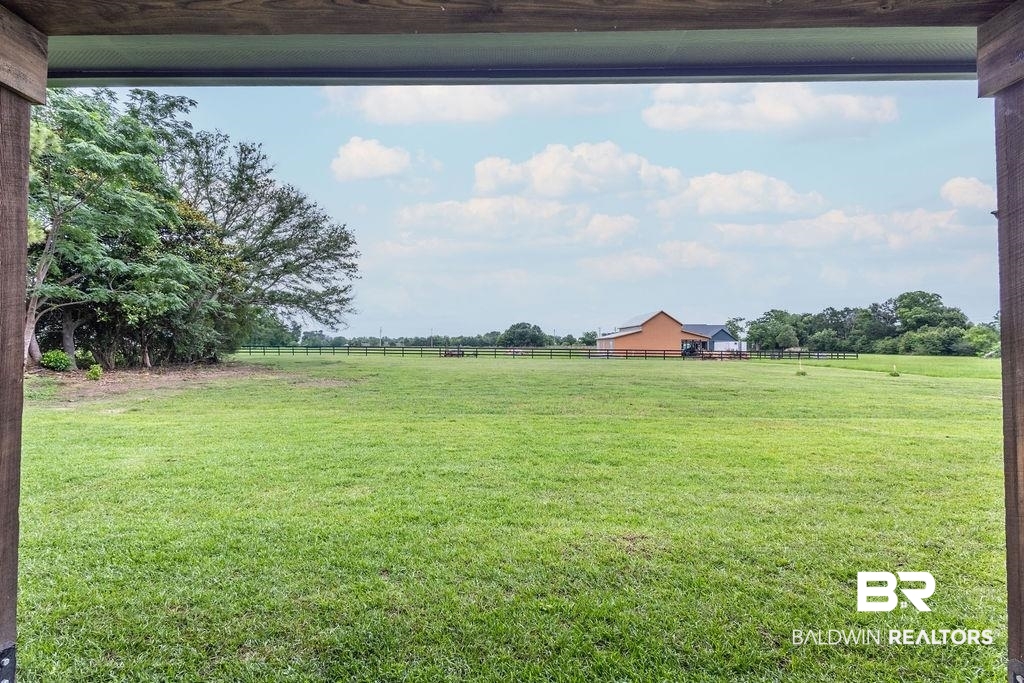 13066 Gopher Court Elberta, AL 36530 - Photo 27 of 38 Expansive green acreage featuring a perimeter fence and scattered trees