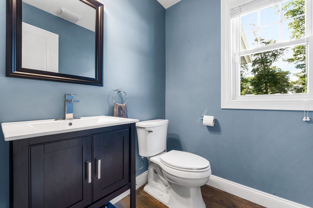 138 Dedham Street Canton, MA 02021 - Photo 11 of 41 a bathroom with a toilet sink and mirror