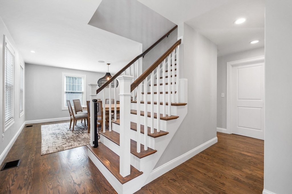 138 Dedham Street Canton, MA 02021 - Photo 12 of 41 a view of entryway with wooden floor and stairs